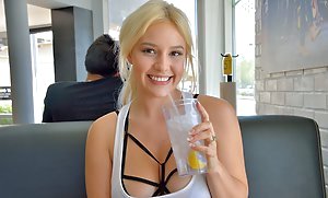 Adorable blonde letting her boobies hang free in a solo gallery