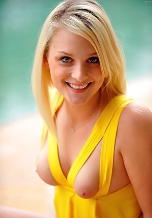 Blond-haired babe in a yellow dress gets fisted after masturbating outdoors