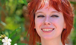 Playful and nerdy redheaded teen shows her hot body in public